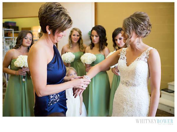 Mother of the Bride helps her put jewelry on. Image by Whitney Bower Imaging, featured on The Pink Bride www.thepinkbride.com {Touchy Wedding Situation #6: Mom vs. Stepmom}