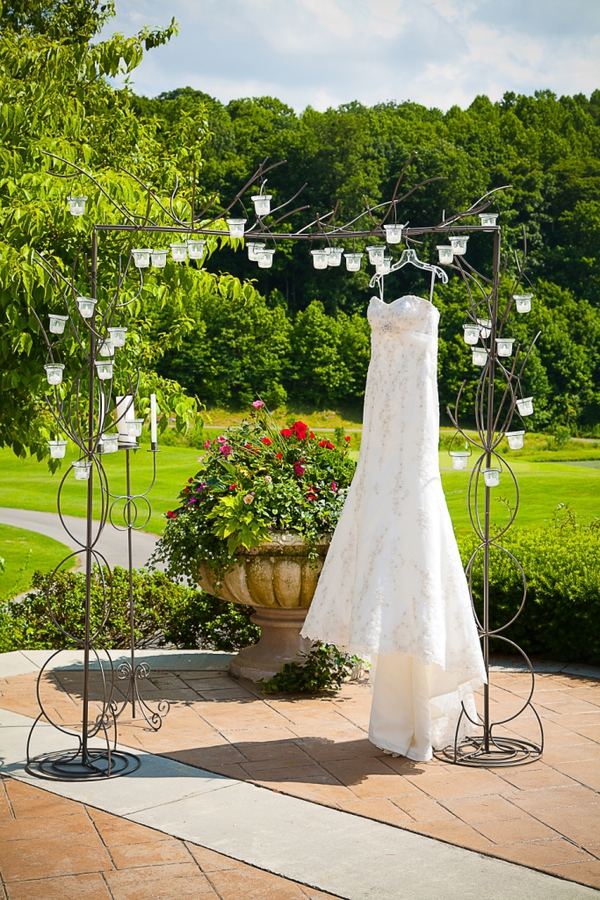 Wedding dress hanging from arch at Blackthorn Club for Jonesborough wedding | The Pink Bride {Top Five Myths Surrounding Country Club Weddings}