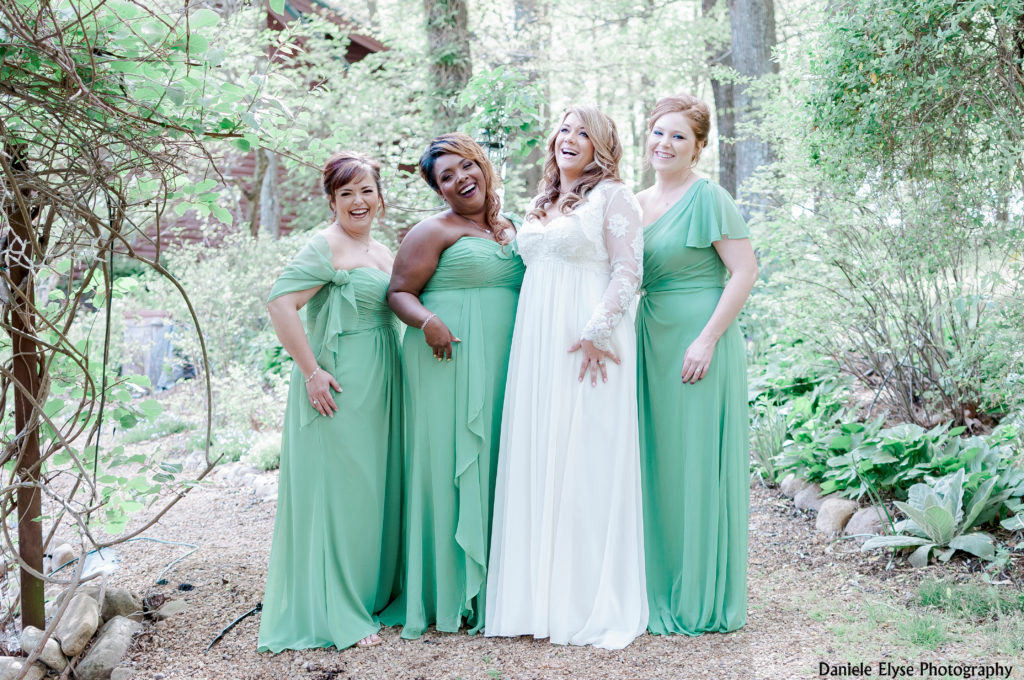 Bride with her bridesmaids who are wearing stunning mint green dresses. Photo Credit: Daniele Elyse Photography | The Pink Bride® www.thepinkbride.com