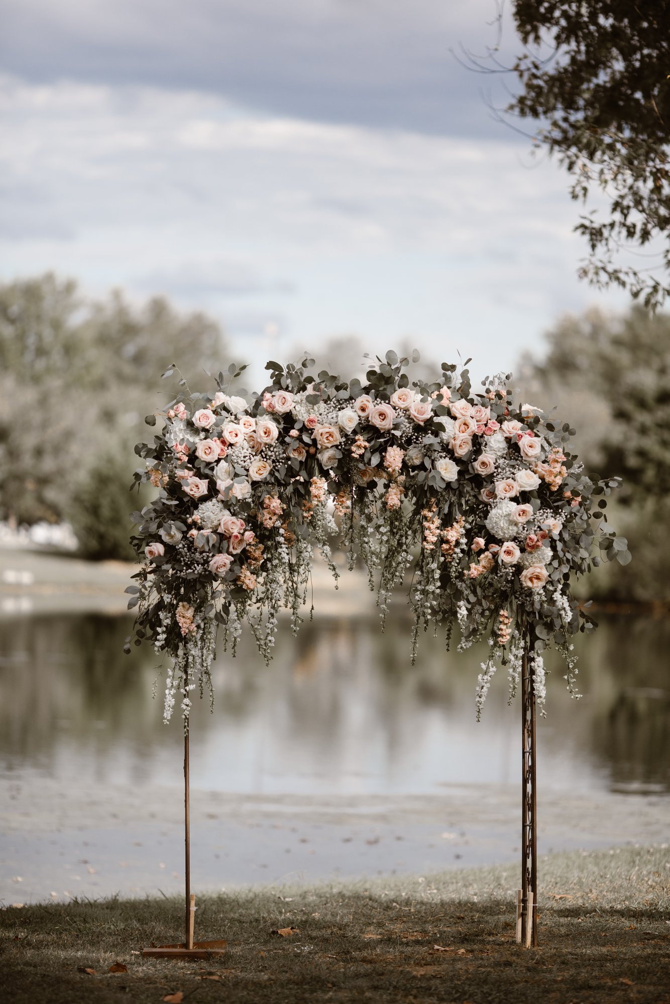 Wedding arch covered in white and pink roses from LB Floral by Erin Morrison Photography | The Pink Bride® www.thepinkbride.com